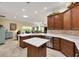 Open-concept kitchen showcasing sleek countertops, ample cabinetry, and modern appliances at 1376 Birdsong Pl, The Villages, FL 32163