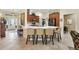 Beautiful kitchen with a large island, sleek countertops, and a view to the foyer at 1376 Birdsong Pl, The Villages, FL 32163