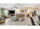 Spacious living room with large tile flooring, ceiling fan, and natural light at 1376 Birdsong Pl, The Villages, FL 32163