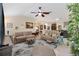 Comfortable living room with ceiling fan and an open floor plan at 1376 Birdsong Pl, The Villages, FL 32163
