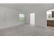 A spacious bedroom with a view of the en-suite bathroom and neutral decor at 1449 Jeremy Cir, The Villages, FL 34762