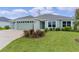 Charming one-story home featuring a two-car garage and well-maintained landscaping at 1449 Jeremy Cir, The Villages, FL 34762