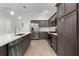 Modern kitchen featuring stainless steel appliances, spacious island, and sleek countertops at 1449 Jeremy Cir, The Villages, FL 34762