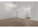 Bright living room with light wood floors and an open floorplan at 1449 Jeremy Cir, The Villages, FL 34762