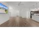 Bright living room featuring modern ceiling fan and easy access to kitchen and entry at 1449 Jeremy Cir, The Villages, FL 34762