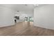 Bright living room with light wood floors in an open floorplan at 1449 Jeremy Cir, The Villages, FL 34762