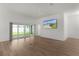 Bright living room with light wood floors and sliding glass door at 1449 Jeremy Cir, The Villages, FL 34762
