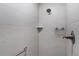 Tiled shower with rainfall shower head, built in niche, and grab bar at 1449 Jeremy Cir, The Villages, FL 34762