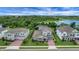Gorgeous home with brick driveway, well-manicured lawn and screened-in patio near a lake and lush green woods at 14501 Wabasso Loop, Winter Garden, FL 34787