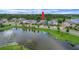 Aerial view of the house with water view, fountain, and landscaping at 14501 Wabasso Loop, Winter Garden, FL 34787