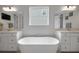 Bright bathroom features a soaking tub, dual sinks, and ample counter space at 14501 Wabasso Loop, Winter Garden, FL 34787