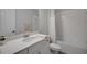 Bright bathroom with a shower-tub combo, a toilet and a large vanity with quartz countertop at 14501 Wabasso Loop, Winter Garden, FL 34787