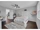 Bright bedroom with a white upholstered bed frame, a ceiling fan, and a cozy hammock holding stuffed animals at 14501 Wabasso Loop, Winter Garden, FL 34787