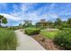 Walking path to a lovely community gazebo and outdoor grilling area on a beautiful, sunny day at 14501 Wabasso Loop, Winter Garden, FL 34787
