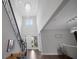 Bright foyer features hardwood floors, a soaring ceiling, and a sparkling chandelier at 14501 Wabasso Loop, Winter Garden, FL 34787