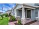 Charming front porch with stone accents, manicured landscaping, and a brick pathway leading to the entrance at 14501 Wabasso Loop, Winter Garden, FL 34787