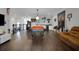 Game room featuring a pool table, bar with wine cooler, and leather couch at 14501 Wabasso Loop, Winter Garden, FL 34787