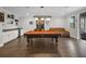 Spacious game room with a pool table, bar, and seating area at 14501 Wabasso Loop, Winter Garden, FL 34787