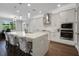 Bright kitchen with stainless steel appliances, spacious island with seating, and modern finishes at 14501 Wabasso Loop, Winter Garden, FL 34787