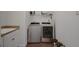 Bright laundry room features a sink, counter space, and modern washer and dryer at 14501 Wabasso Loop, Winter Garden, FL 34787