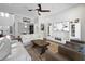 Spacious living room with modern decor, large TV, and comfortable seating arrangement at 14501 Wabasso Loop, Winter Garden, FL 34787