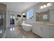 Spa-like main bathroom features a soaking tub, dual vanities, and a walk-in shower at 14501 Wabasso Loop, Winter Garden, FL 34787