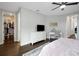 Main bedroom with a view of the walk-in closet, a dresser, and a small desk with drawers at 14501 Wabasso Loop, Winter Garden, FL 34787