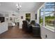 Bright office space with a view of the pool and the backyard through the oversized window at 14501 Wabasso Loop, Winter Garden, FL 34787