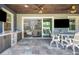 Inviting outdoor space with a kitchen, seating area, and a seamless flow to the indoors at 14501 Wabasso Loop, Winter Garden, FL 34787
