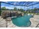 Beautiful screened-in pool with a rock waterfall, slide, and in-pool lounge chairs at 14501 Wabasso Loop, Winter Garden, FL 34787