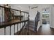 View of an elegant staircase leading to a game room with arcade games and a pool table at 14501 Wabasso Loop, Winter Garden, FL 34787