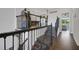 Elegant staircase leads to a game room with arcade games and pool table at 14501 Wabasso Loop, Winter Garden, FL 34787