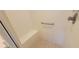 Enclosed shower featuring built in seat and a grab bar at 1550 Ward Ct, The Villages, FL 32162