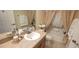 Cozy bathroom featuring a shower-tub combo, vanity with mirror, and tasteful décor at 1550 Ward Ct, The Villages, FL 32162