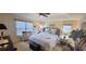 Beautiful bedroom featuring a ceiling fan, dresser, and a comfortable queen sized bed at 1550 Ward Ct, The Villages, FL 32162