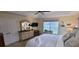 Inviting bedroom featuring neutral carpet and tones, plus an en suite at 1550 Ward Ct, The Villages, FL 32162