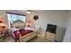 Charming bedroom with a queen-sized bed, neutral furniture and soft decor, creating a relaxing atmosphere at 1550 Ward Ct, The Villages, FL 32162