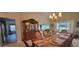 Spacious dining room featuring decorative accents and an open layout to the living area at 1550 Ward Ct, The Villages, FL 32162