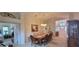 Beautiful dining room with ample seating for gatherings and a view into the foyer at 1550 Ward Ct, The Villages, FL 32162