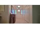 Bright foyer featuring tile flooring, coat closet, and decorative front door at 1550 Ward Ct, The Villages, FL 32162