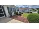 Well-maintained lawn with tidy shrubbery adds curb appeal to this lovely home at 1550 Ward Ct, The Villages, FL 32162