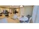 Spacious kitchen with stainless steel appliances, granite countertops, and a breakfast nook with natural light at 1550 Ward Ct, The Villages, FL 32162