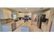 Spacious kitchen features stainless steel appliances, granite countertops, and ample cabinet space at 1550 Ward Ct, The Villages, FL 32162