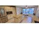 Kitchen with stainless appliances, a central island, white cabinetry, and a bright breakfast area at 1550 Ward Ct, The Villages, FL 32162