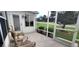 Outdoor patio featuring two chairs and small table with great views of the neighborhood at 1550 Ward Ct, The Villages, FL 32162