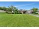 Lush green backyard with mature landscaping, complemented by a well-maintained lawn at 15531 Waterleigh Cove Dr, Winter Garden, FL 34787