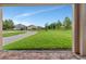 Well-manicured backyard showcasing lush green lawn and neighborhood views at 15531 Waterleigh Cove Dr, Winter Garden, FL 34787