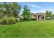 Beautifully maintained backyard with mature trees and a well-kept lawn at 15531 Waterleigh Cove Dr, Winter Garden, FL 34787