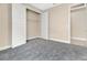 Bedroom featuring plush gray carpeting, and closet with white doors, offering ample storage space at 15531 Waterleigh Cove Dr, Winter Garden, FL 34787