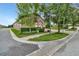 Inviting home with a two-car garage, paver driveway, and carefully manicured landscaping at 15531 Waterleigh Cove Dr, Winter Garden, FL 34787